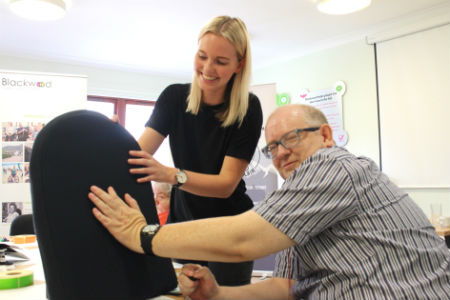 Residents test cushion for wheelchair users