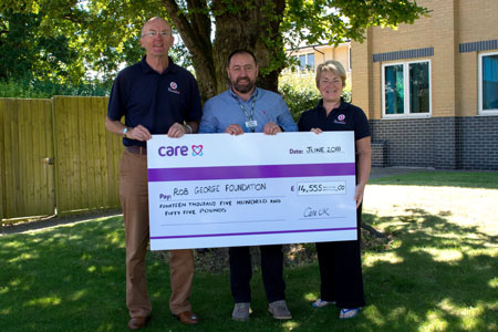 Care UK adventurer hands over cheque 